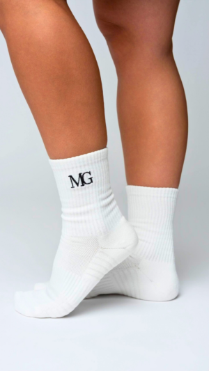 White MG Wear socks with the MG logo.