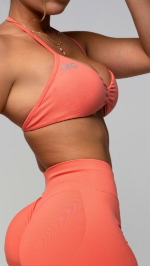 Peach MG top, close-up, studio.
